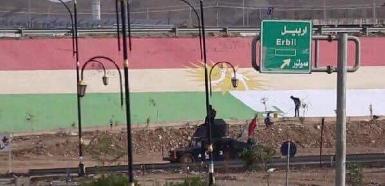 Ополченцы "Хашд аш-Шааби" закрасили гигантский флаг Курдистана в Киркуке