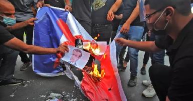 Иракские протестующие сожгли французский флаг и фото Макрона